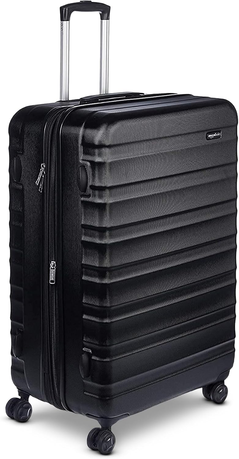 Amazon Basics 21" Hardside Carry-On Luggage. Hardshell Suitcase With Wheels. Expandable For Up to 25% More Space. With Scratch-Resistant Surface. Four Multi-directional Wheels. Black