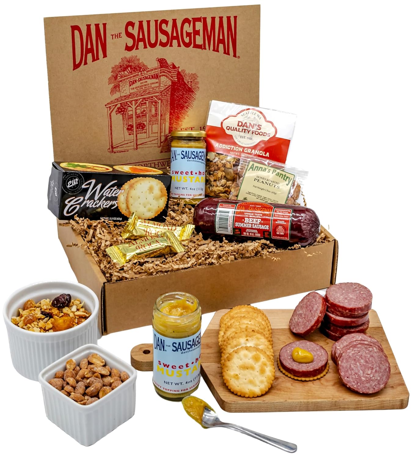 Dan the Sausageman Klondike Gourmet Meat Snack Box with Summer Sausage. Sweet Mustard. Water Crackers. Honey Roasted Peanuts. Addiction Granola. Almond Roca – 7-Piece Items Holiday Box