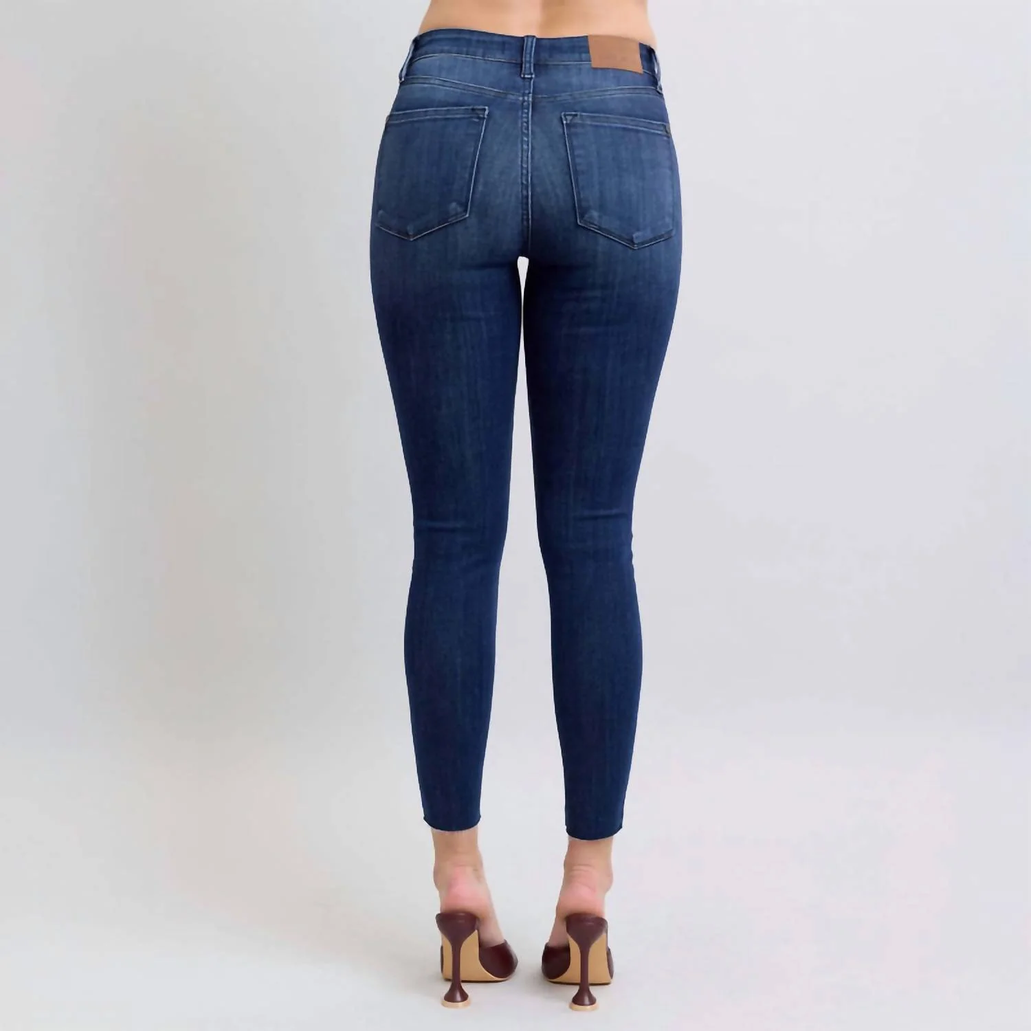 Mid Rise Raw Hem Skinny Jeans In Blue