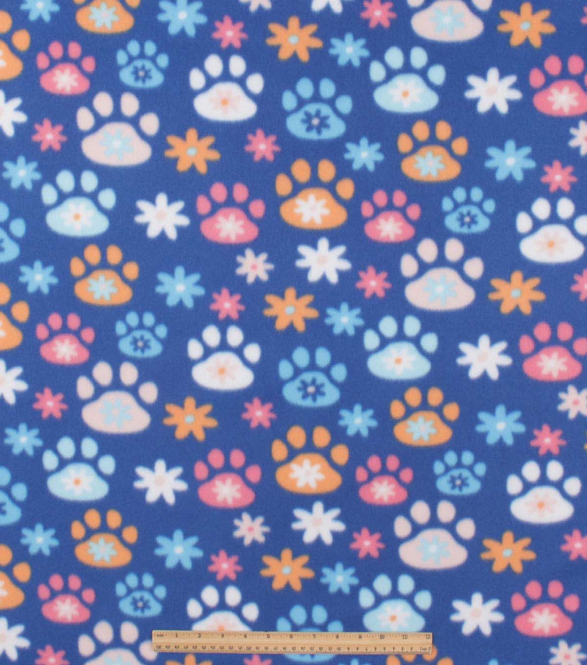 Floral Paw Prints on Blue Blizzard Fleece Fabric